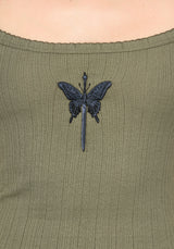 Close up detail of blue embroidery butterfly detail on khaki vest