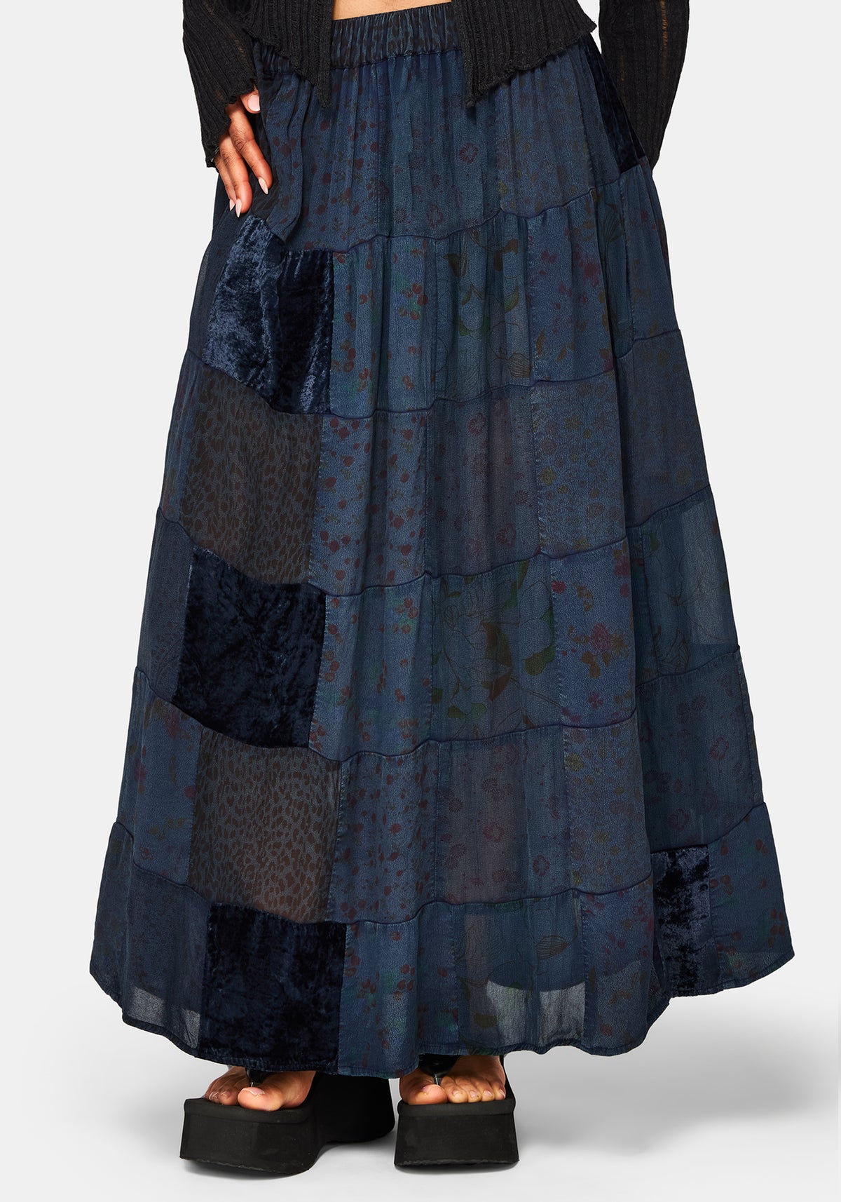 Long dark blue tiered skirt with pattern on a white background