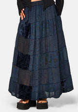 Long dark blue tiered skirt with pattern on a white background