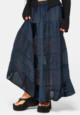 Navy blue layered skirt worn by a person on a white background